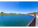 Beautiful community lake view, surrounded by green spaces and inviting pathways, enhancing the neighborhood's appeal at 9837 E Satellite Dr, Mesa, AZ 85212
