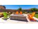 Outdoor firepit area with Adirondack chairs, offering a cozy space for relaxation and gatherings at 9837 E Satellite Dr, Mesa, AZ 85212