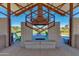 Outdoor brick fireplace with seating offers a cozy spot for gathering in the community common area at 9837 E Satellite Dr, Mesa, AZ 85212