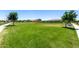 Lush green community space with mature trees, providing ample room for recreation and relaxation at 9837 E Satellite Dr, Mesa, AZ 85212