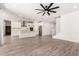 Open kitchen featuring white cabinets, stainless steel appliances, and a center island at 9837 E Satellite Dr, Mesa, AZ 85212