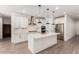 Modern kitchen featuring a center island with a sink, white cabinetry, and stainless steel appliances at 9837 E Satellite Dr, Mesa, AZ 85212