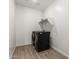 The laundry room has side-by-side washer and dryer units and a shelf above at 9837 E Satellite Dr, Mesa, AZ 85212