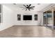 Spacious living room with hard surface floors, ceiling fan, and a large window for plenty of natural light at 9837 E Satellite Dr, Mesa, AZ 85212