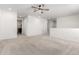 Spacious carpeted loft area with ceiling fan, neutral walls, and ample natural light at 9837 E Satellite Dr, Mesa, AZ 85212