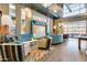 Stylish lounge area with comfortable seating, modern decor, and large windows offering a welcoming atmosphere at 9837 E Satellite Dr, Mesa, AZ 85212