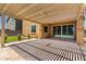 Covered patio with a pergola roof overlooking the turfed backyard at 9837 E Satellite Dr, Mesa, AZ 85212