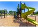 Community playground with green slides and climbing features for to enjoy a day of active play at 9837 E Satellite Dr, Mesa, AZ 85212