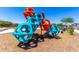 A fun playground with colorful geometric structures for children to climb and play on a summer day at 9837 E Satellite Dr, Mesa, AZ 85212