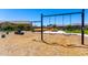 A community playground featuring swings and a tire swing surrounded by lush green lawns and trees at 9837 E Satellite Dr, Mesa, AZ 85212