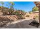 Landscaped backyard with stone patio and privacy wall offers a serene outdoor living space at 10626 N 8Th St, Phoenix, AZ 85020