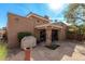 An exterior view of a home with a backyard, landscaping, covered patio, and exterior grill at 10626 N 8Th St, Phoenix, AZ 85020