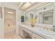 Bathroom features double sinks, large mirror, plenty of counter space, and a separate bathtub at 10626 N 8Th St, Phoenix, AZ 85020