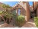 Neutral home exterior with desert landscaping and a red tiled roof and well trimmed yard at 10626 N 8Th St, Phoenix, AZ 85020