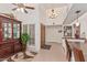 Foyer with tiled floor, dark wood accents, front door and hallway to other rooms at 10626 N 8Th St, Phoenix, AZ 85020