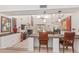 Open floor plan showcasing a living room with fireplace and a kitchen island with seating at 10626 N 8Th St, Phoenix, AZ 85020