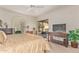 Spacious main bedroom with ceiling fan, access to the patio, and an entertainment center at 10626 N 8Th St, Phoenix, AZ 85020