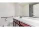 Bathroom featuring a large mirror, spacious counter, toilet, and handicap bar at 12128 W Range Mule Dr, Peoria, AZ 85383