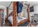 Bedroom with four poster bed, decorative lighting, light colored walls, and a comfortable inviting atmosphere at 12128 W Range Mule Dr, Peoria, AZ 85383