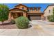 Inviting two-story home featuring a well-maintained yard and a spacious two-car garage at 12128 W Range Mule Dr, Peoria, AZ 85383