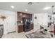 Spacious kitchen with dark cabinets, stainless steel appliances, granite counters, and access to multiple doorways at 12128 W Range Mule Dr, Peoria, AZ 85383