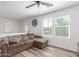Upstairs living room with couch, hardwood floor, ceiling fan and natural light at 12128 W Range Mule Dr, Peoria, AZ 85383