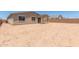 Expansive backyard with ample space for landscaping and recreational activities, complemented by a covered patio at 12389 W Marguerite Ave, Avondale, AZ 85323
