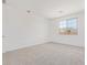 Bright, carpeted bedroom with a window offering plenty of natural light at 12389 W Marguerite Ave, Avondale, AZ 85323