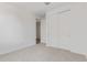 Cozy bedroom with plush carpeting, closet, and natural light at 12389 W Marguerite Ave, Avondale, AZ 85323