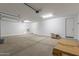 Spacious, well-lit garage with a high ceiling and ample storage area at 12389 W Marguerite Ave, Avondale, AZ 85323