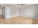 Bright bedroom with ceiling fan, neutral walls and tile flooring throughout at 1245 W Lobo Ave, Mesa, AZ 85202