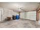 Spacious garage featuring a functional roll-up door and ample room for storage at 1245 W Lobo Ave, Mesa, AZ 85202