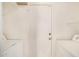 All-white laundry room with washer and dryer hookups, perfect for functionality and cleanliness at 1245 W Lobo Ave, Mesa, AZ 85202
