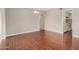 Spacious living room with hardwood floors, neutral paint, and great natural light at 1245 W Lobo Ave, Mesa, AZ 85202