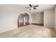 Inviting living room with a ceiling fan and plush carpeting is an entertainer's dream at 1245 W Lobo Ave, Mesa, AZ 85202