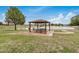 Relaxing park area with picnic gazebo, a lake, and lush greenery at 1245 W Lobo Ave, Mesa, AZ 85202