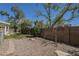 Backyard area featuring gravel, artificial turf, and perimeter block wall at 1320 N Brittany Ln, Gilbert, AZ 85233