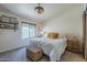 Bright bedroom featuring a large window, neutral walls and decorative shelves at 1320 N Brittany Ln, Gilbert, AZ 85233
