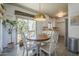 Sunlit dining area features a stylish pendant light and sliding glass doors at 1320 N Brittany Ln, Gilbert, AZ 85233