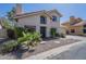 Charming stucco home featuring a tile roof, desert landscaping, and a welcoming front entrance at 1320 N Brittany Ln, Gilbert, AZ 85233