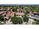 Stunning aerial view of a neighborhood showcasing well-maintained homes and mature trees at 13722 N 150Th Ln, Surprise, AZ 85379