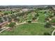 This aerial view showcases the community's extensive park with walking paths, lush greenery, and recreational spaces at 13722 N 150Th Ln, Surprise, AZ 85379
