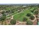 A lush green park features winding walking trails and shady trees, providing a peaceful escape within the community at 13722 N 150Th Ln, Surprise, AZ 85379