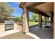 Outdoor grill with a gazebo in the grass backyard at 13722 N 150Th Ln, Surprise, AZ 85379