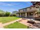 Backyard with brick pathway, patio, built in bbq and covered patio at 13722 N 150Th Ln, Surprise, AZ 85379