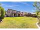 Spacious backyard featuring green grass, a gazebo, and a covered patio at 13722 N 150Th Ln, Surprise, AZ 85379