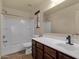 Clean bathroom featuring tub with shower, sleek vanity, and large mirror at 13722 N 150Th Ln, Surprise, AZ 85379