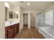 Bathroom with walk-in shower, double sinks, and walk-in closet at 13722 N 150Th Ln, Surprise, AZ 85379