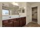 Bathroom featuring double sink vanity, closet, and shower at 13722 N 150Th Ln, Surprise, AZ 85379