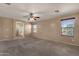 Open bedroom with carpet floors, neutral paint, and a ceiling fan at 13722 N 150Th Ln, Surprise, AZ 85379